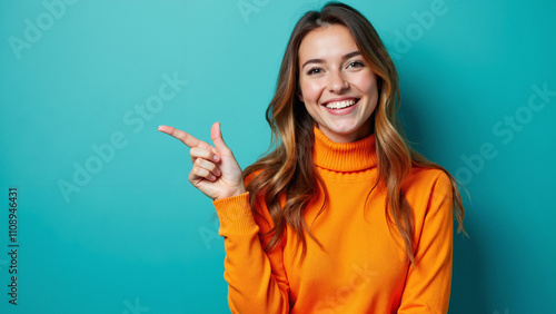 Cheerful Woman in Orange Sweater Pointing: Vibrant Portrait for Advertising, Fashion Blogs, or Lifestyle Magazines