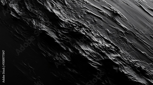 Dark textured background with crisp edges resembling a rugged landscape or geological formation photo