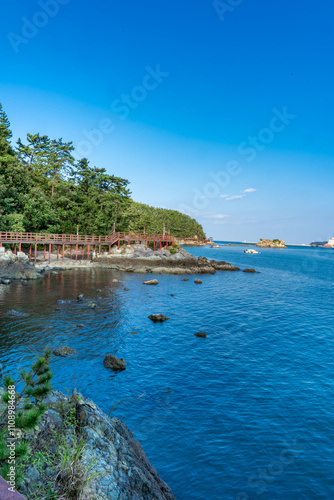 Beatuful Landscape with sea, water, trees, bridge and blue sky in South Korea photo