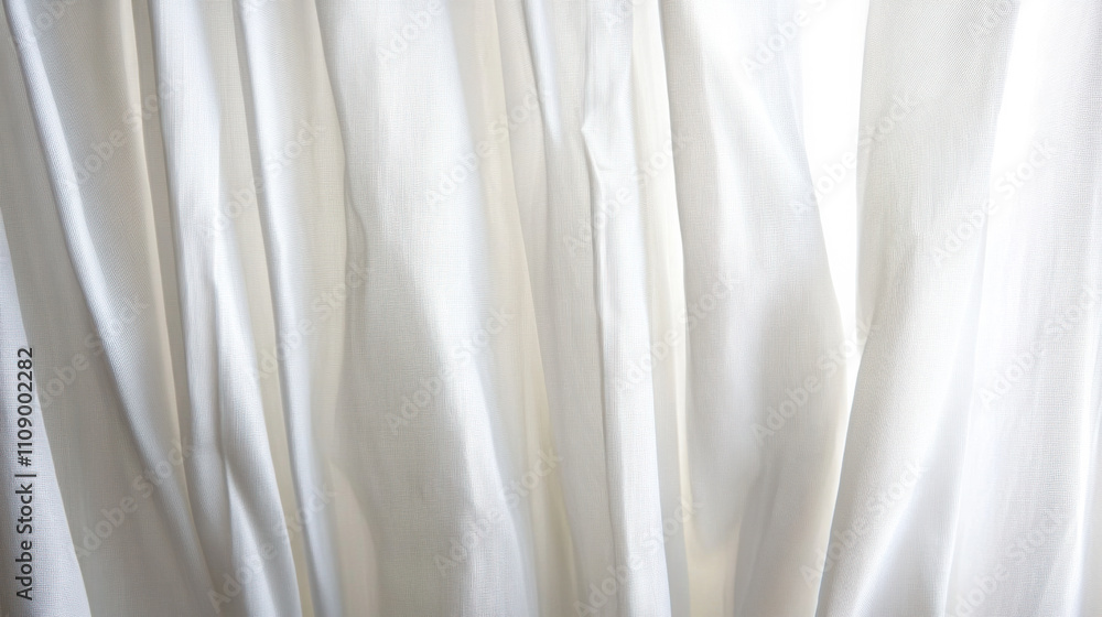 Obraz premium Soft, flowing white fabric drapes elegantly in gentle light creating a serene and calming atmosphere in a minimalistic setting