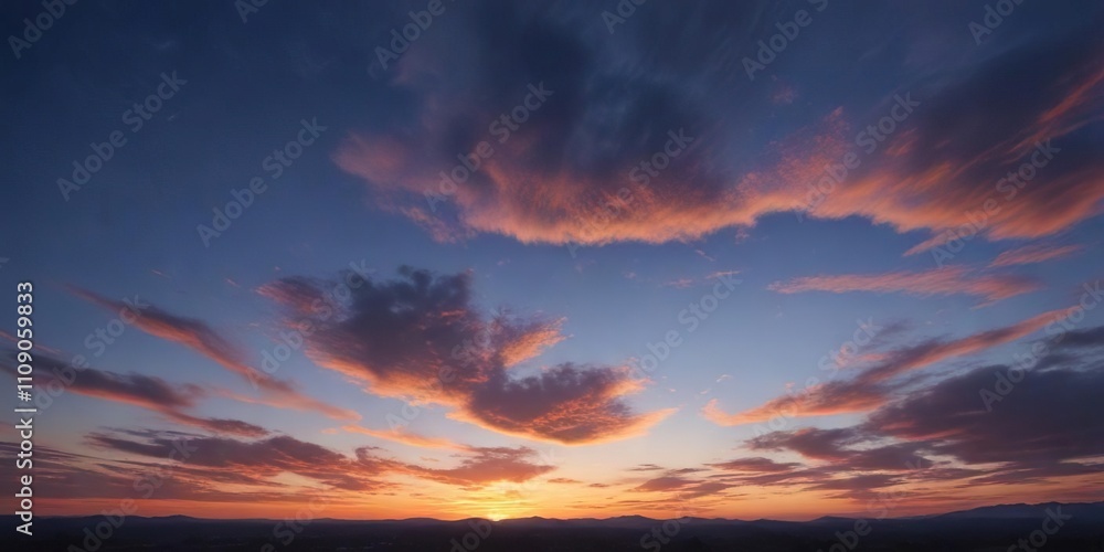 Obraz premium Cobalt blue sky with thin orange cirrostratus clouds at dusk, warm orange color, clear blue sky, nature photography