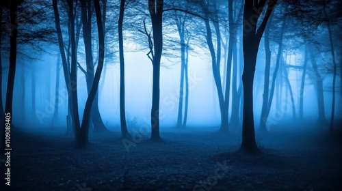 A mysterious forest scene shrouded in blue fog, with silhouettes of trees creating a tranquil yet eerie ambiance, Ideal for use in themes related to nature, solitude, or fantasy storytelling,
