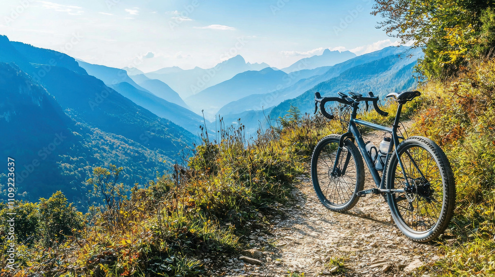 Fototapeta premium Scenic Mountain Trail with a Lone Bicycle Parked Beside Breathtaking Views