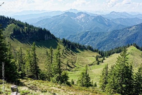 Scenic view of green forested mountain ranges on a sunnyy morning landscape photo