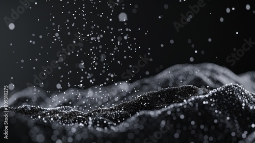 Ethereal particles cascading gracefully against a solid black background, creating a magical effect photo