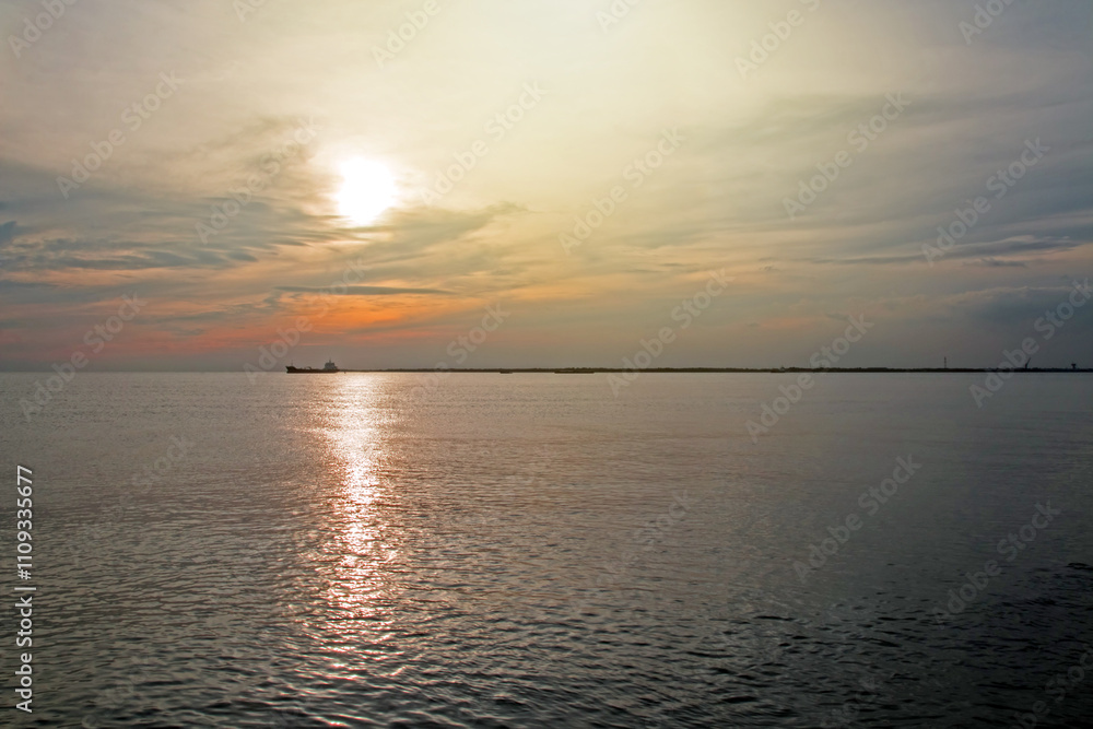Sunlight shines down on the sea surface. Sunlight shines down on the sea surface.