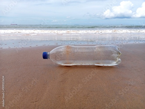 Empty plastic bottle on the beach 