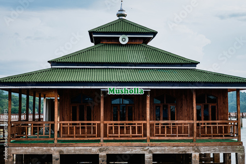 Baubau, Indonesia, March 24 2024 - Traditional wooden mosque on the seafront photo