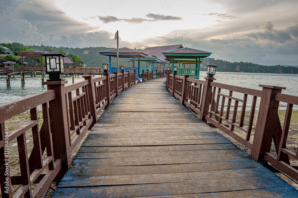 Baubau, Indonesia, March 24 2024 - Titian Bridge, Wooden Pier at Batusori Tourist Attraction When Tranquility Meets Nature Baubau, Indonesia, March 24 2024 - Titian Bridge, Wooden Pier at Batusori Tourist Attraction When Tranquility Meets Nature