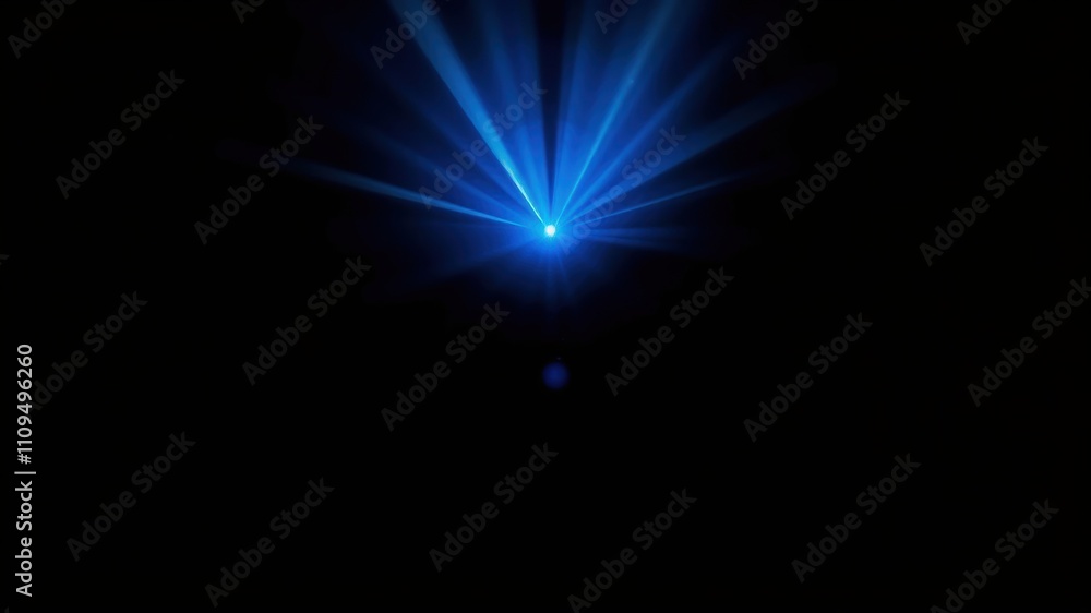 A bright blue light emanating from a projector in a dark room with the light rays projecting out and downward. A bright blue light emanating from a projector in a dark room with the light rays projecting out and downward.