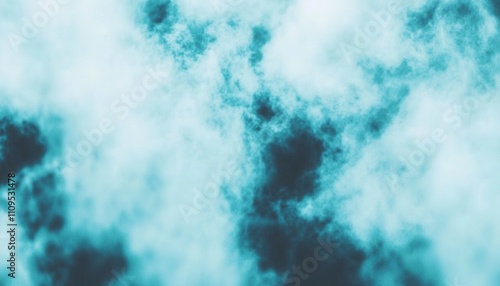 Abstract teal and dark blue cloudy sky texture.