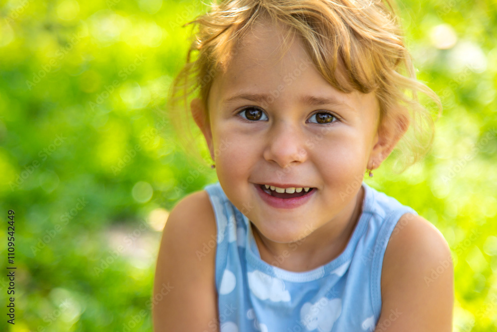 Child looking at caterpillar in garden. Selective focus. Child looking at caterpillar in garden. Selective focus.