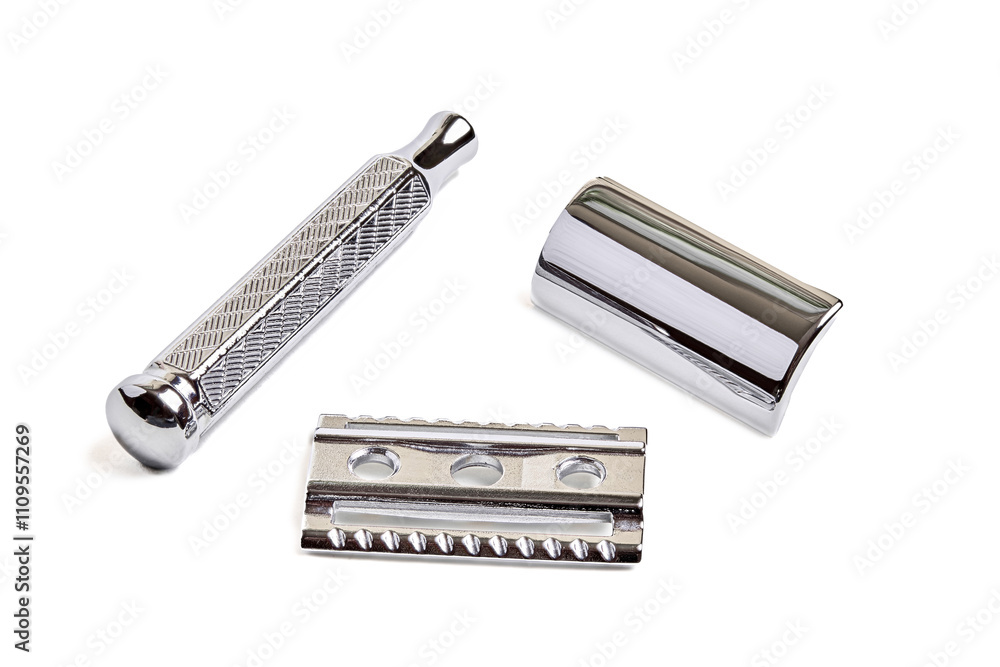Three piece razors details top of cutting head, base and handle. Safety Double-Edge DE Razor with closed comb isolated on white focus stacking shot. Classic Wet Shaving Supplies and Accessories. Three piece razors details top of cutting head, base and handle. Safety Double-Edge DE Razor with closed comb isolated on white focus stacking shot. Classic Wet Shaving Supplies and Accessories.
