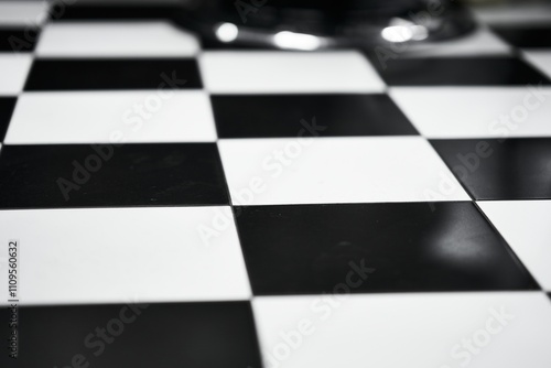 Black and white checkerboard pattern displayed on a polished surface