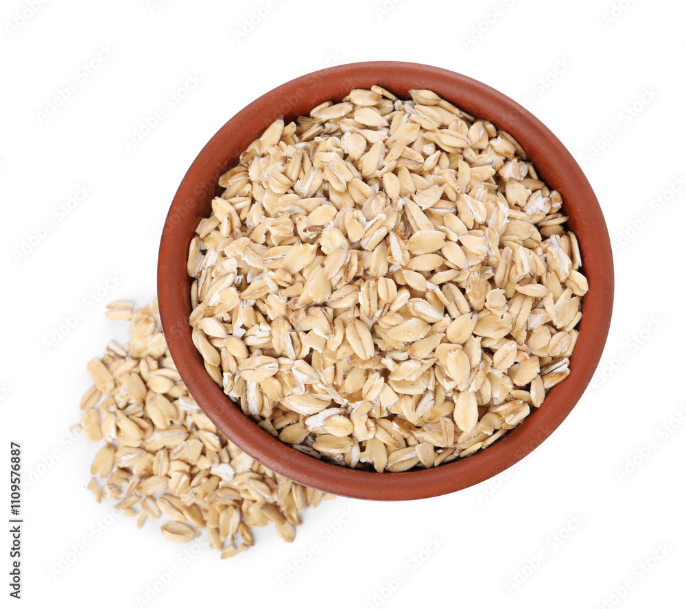 Dry oat flakes in bowl isolated on white, top view Dry oat flakes in bowl isolated on white, top view