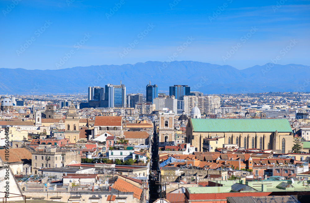Naklejka premium View of Spaccanapoli street splitting city center of Naples. Napoli city skyline with historical Old town, Spaccanapoli street and modern financial district skyscrapers, Italy.