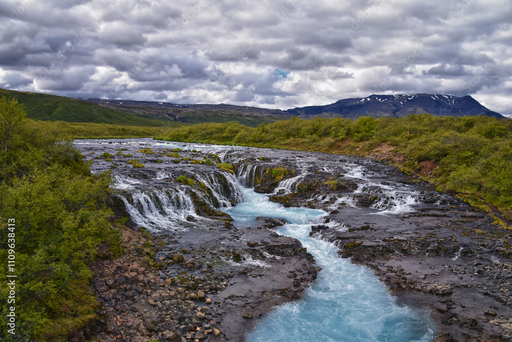Bruarfoss or Bridge Falls, small hidden waterfall blue striking color, Iceland’s Bluest Waterfall, along Bruara river. Golden Circle South Iceland