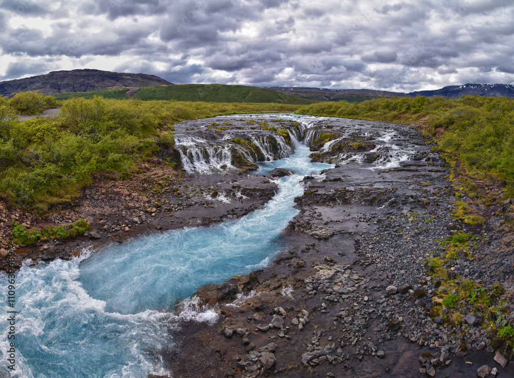 Bruarfoss or Bridge Falls, small hidden waterfall blue striking color, Iceland’s Bluest Waterfall, along Bruara river. Golden Circle South Iceland