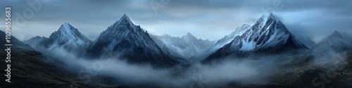 Majestic snow-capped mountains loom under a moody sky filled with clouds and mist.