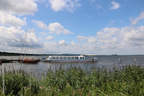 Blick auf das Steinhuder Meer mit Schiff und Boot am Bootsanleger photo