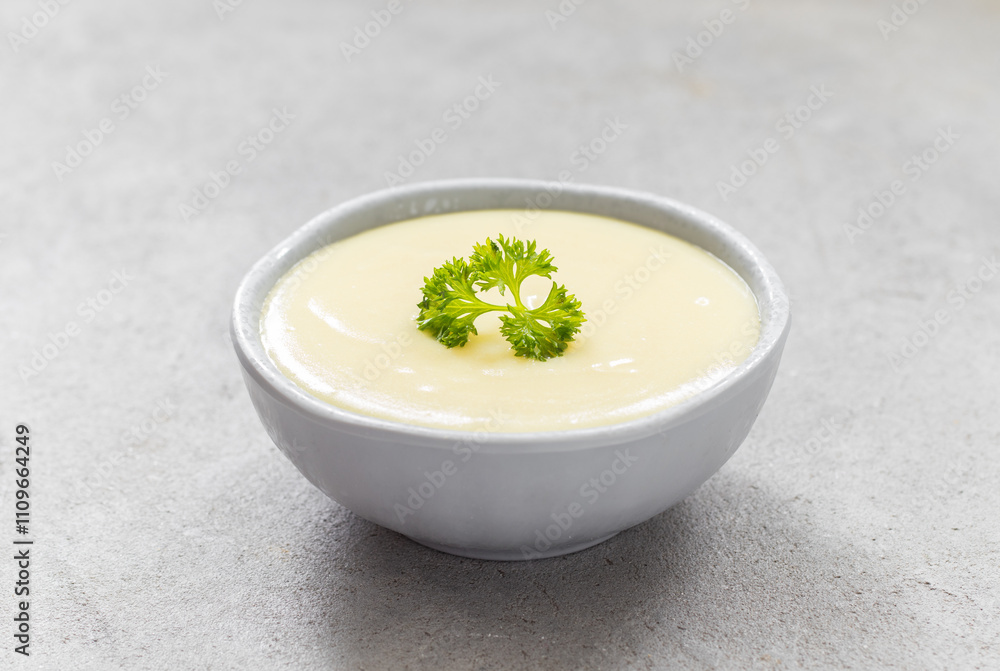 Children Potato cream soup in a bowl. With parsley. Close-up Children Potato cream soup in a bowl. With parsley. Close-up