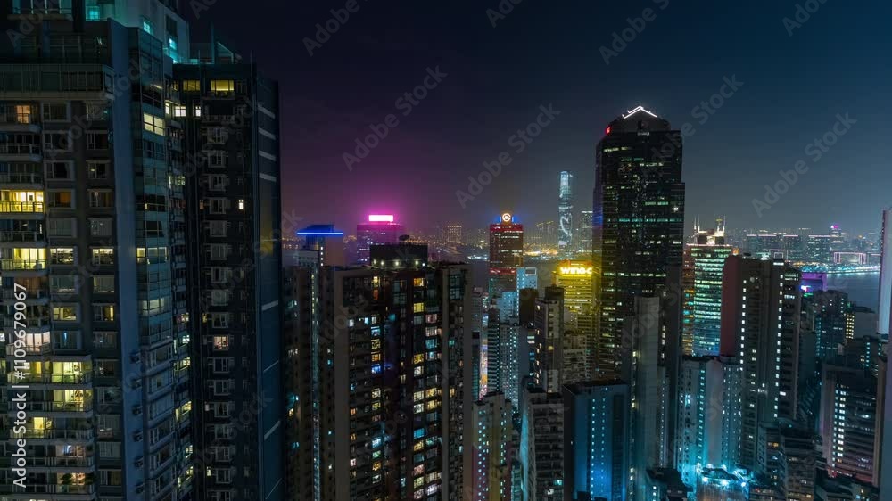 night time illumination hong kong city life famous downtown skyscrapers exterior rooftop panorama 4k timelapse night time illumination hong kong city life famous downtown skyscrapers exterior rooftop panorama 4k timelapse