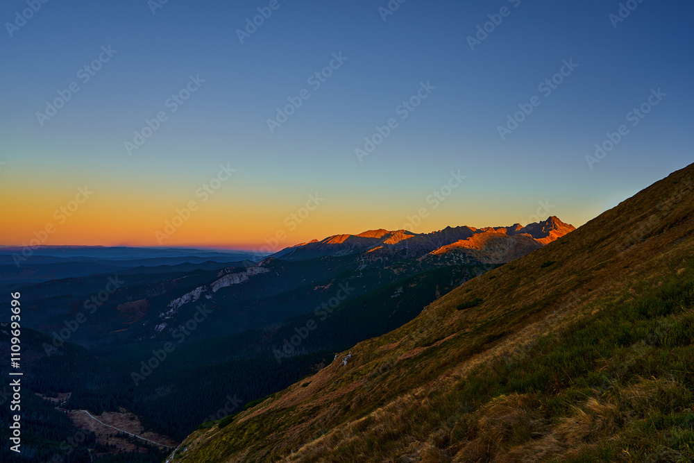 Gradient light over mountain tops, wonderful nature landscape. Perfect view spot for tourists Gradient light over mountain tops, wonderful nature landscape. Perfect view spot for tourists