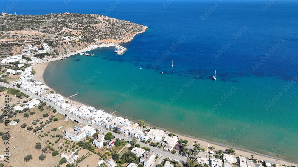 Obraz premium Aerial drone photo of famous beach ideal for families and small seaside village of Platy Gialos, Sifnos island, Cyclades, Greece