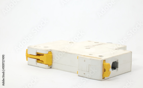 An MCB or Miniature Circuit Breaker on a white background. MCCB functions as a protection system to protect the electrical system from damage due to excessive current or short circuit.  photo