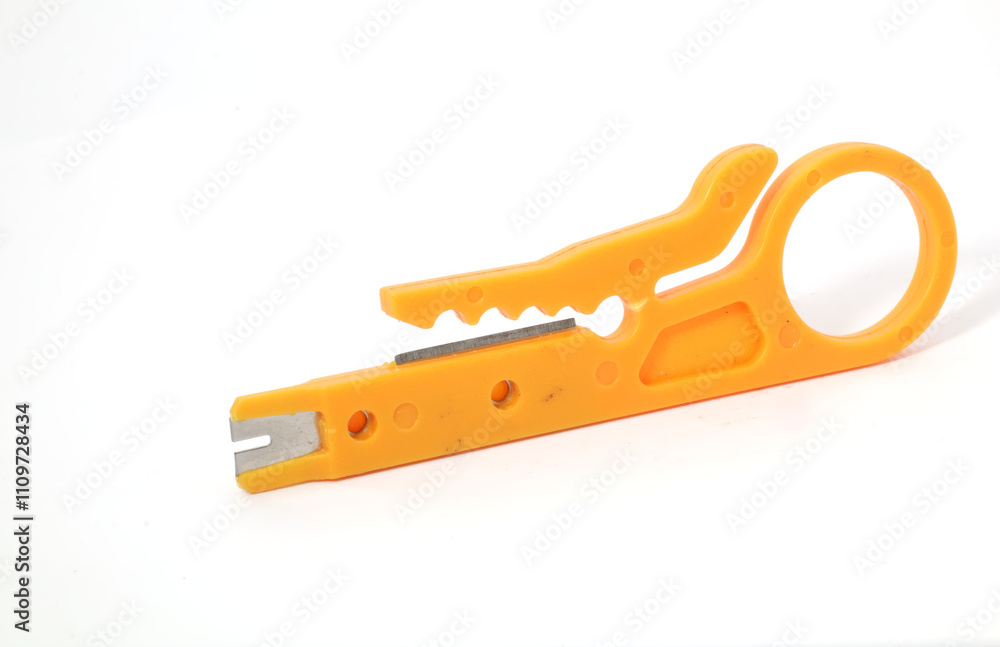 A yellow wire stripper on a white background. Used by electronics, mechatronics, and networking engineers. A yellow wire stripper on a white background. Used by electronics, mechatronics, and networking engineers.