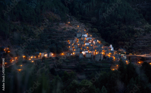 night view of the lights of small city in the mountains 