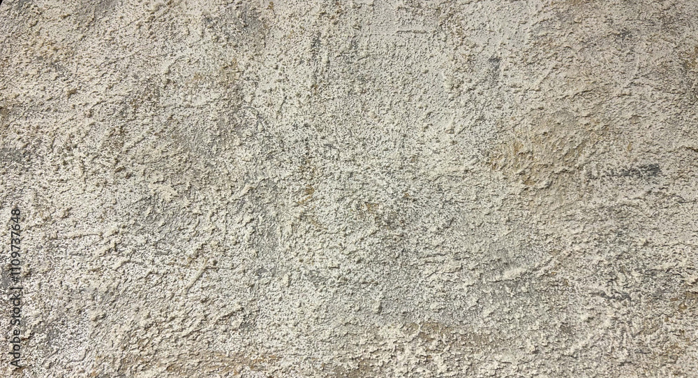 Rough textured beige wall close-up with natural uneven patterns, ideal for use as a background in architectural, interior design, or construction-related projects, emphasizing rustic and earthy aesthe Rough textured beige wall close-up with natural uneven patterns, ideal for use as a background in architectural, interior design, or construction-related projects, emphasizing rustic and earthy aesthe