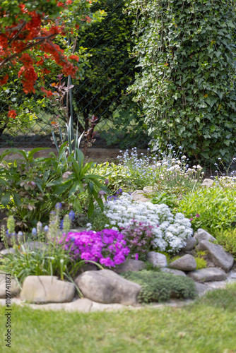 Obraz na płótnie Beautiful colorful spring rock garden, blooming flowers w salonie