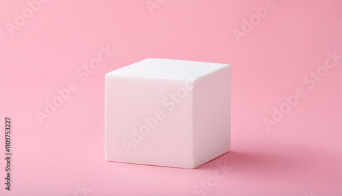 White cube on light pink background. Pedestal for product presentation. Empty podium. Mock-up.