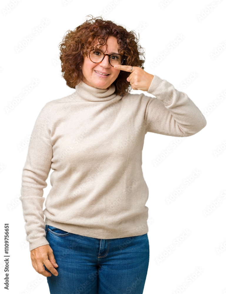 Beautiful middle ager senior woman wearing turtleneck sweater and glasses over isolated background Pointing with hand finger to face and nose, smiling cheerful Beautiful middle ager senior woman wearing turtleneck sweater and glasses over isolated background Pointing with hand finger to face and nose, smiling cheerful