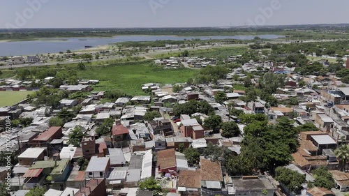 Drone orbits to the right over Ricardo Brugada neighborhood, la Chacarita, in Asuncion, Paraguay photo