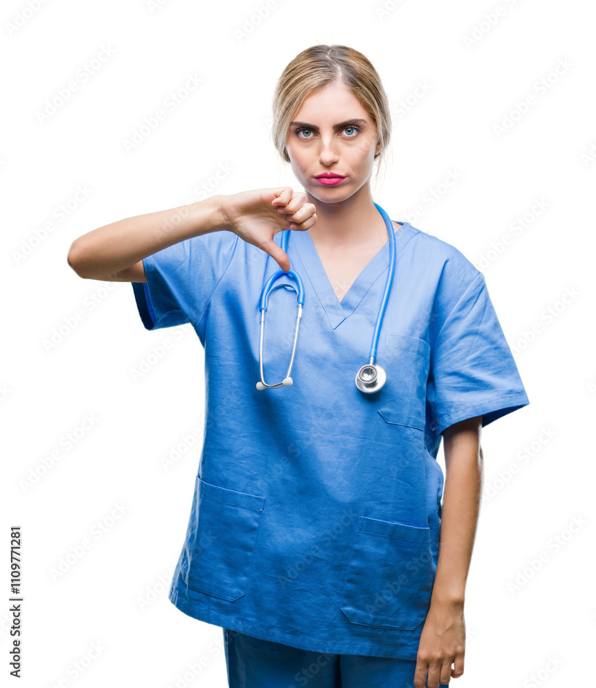 Young beautiful blonde doctor surgeon nurse woman over isolated background looking unhappy and angry showing rejection and negative with thumbs down gesture. Bad expression. Young beautiful blonde doctor surgeon nurse woman over isolated background looking unhappy and angry showing rejection and negative with thumbs down gesture. Bad expression.