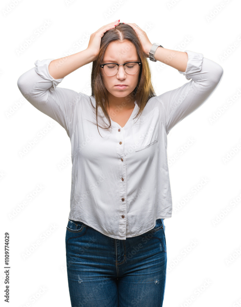 Young caucasian beautiful business woman wearing glasses over isolated background suffering from headache desperate and stressed because pain and migraine. Hands on head. Young caucasian beautiful business woman wearing glasses over isolated background suffering from headache desperate and stressed because pain and migraine. Hands on head.
