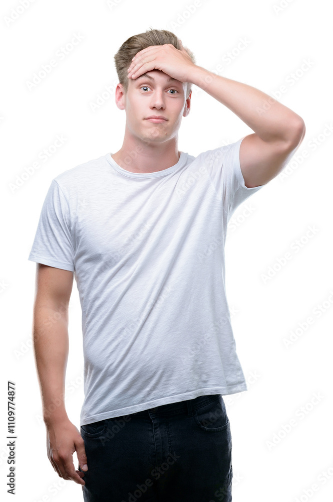 Young handsome blond man stressed with hand on head, shocked with shame and surprise face, angry and frustrated. Fear and upset for mistake. Young handsome blond man stressed with hand on head, shocked with shame and surprise face, angry and frustrated. Fear and upset for mistake.