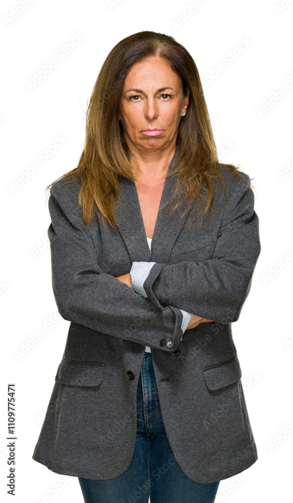 Middle age adult woman wearing oversize boyfriend jacket over isolated background skeptic and nervous, disapproving expression on face with crossed arms. Negative person. Middle age adult woman wearing oversize boyfriend jacket over isolated background skeptic and nervous, disapproving expression on face with crossed arms. Negative person.