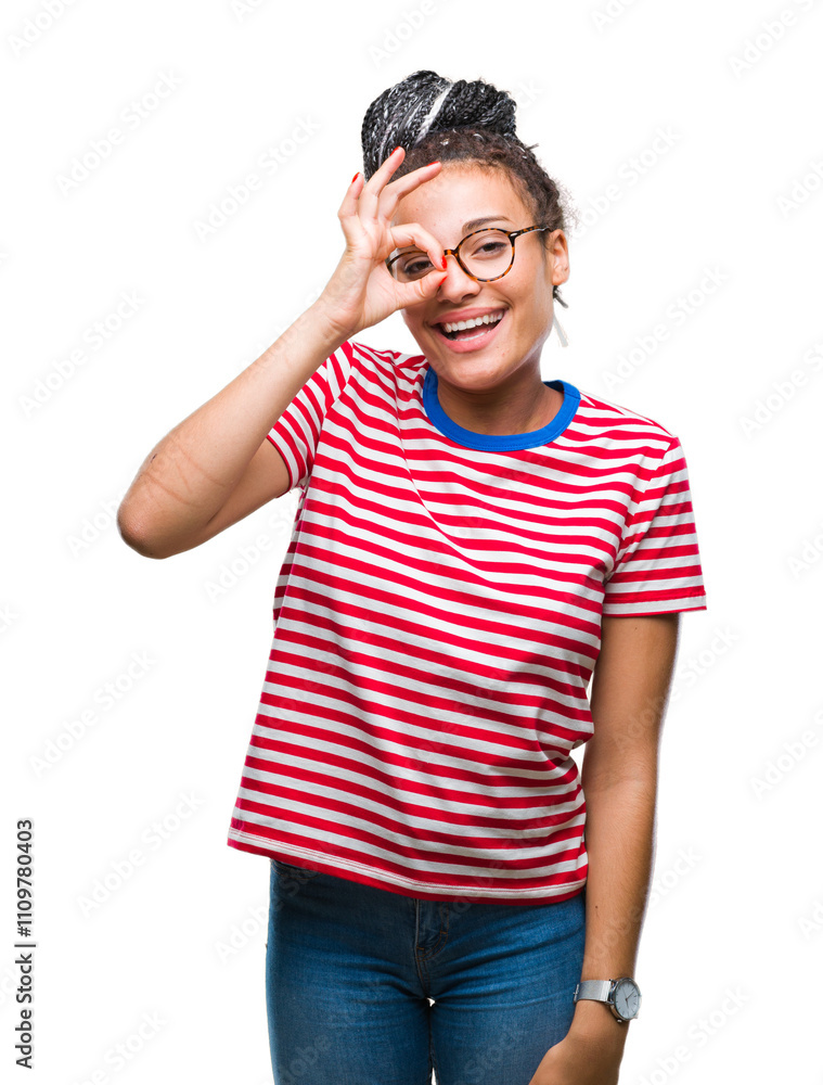 Young braided hair african american girl wearing glasses over isolated background doing ok gesture with hand smiling, eye looking through fingers with happy face. Young braided hair african american girl wearing glasses over isolated background doing ok gesture with hand smiling, eye looking through fingers with happy face.