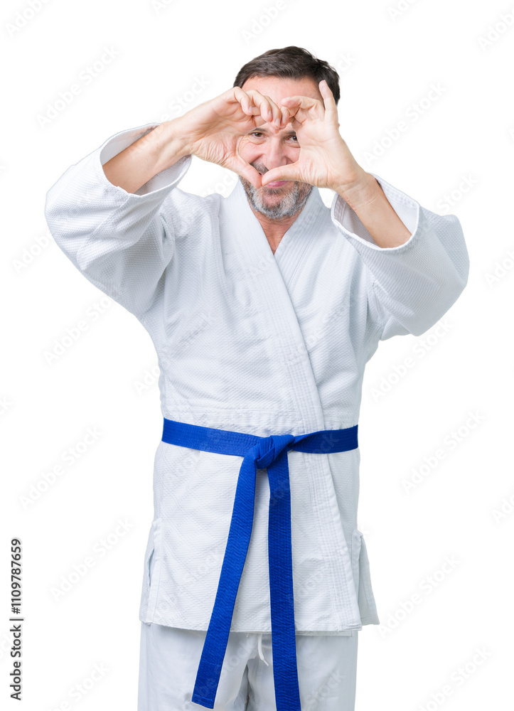 Handsome middle age senior man wearing kimono uniform over isolated background Doing heart shape with hand and fingers smiling looking through sign Handsome middle age senior man wearing kimono uniform over isolated background Doing heart shape with hand and fingers smiling looking through sign