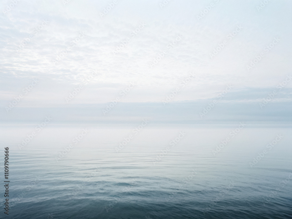 A serene panoramic view of a calm ocean under a foggy morning sky, blending soft hues with a tranquil, infinite horizon. Generative AI A serene panoramic view of a calm ocean under a foggy morning sky, blending soft hues with a tranquil, infinite horizon. Generative AI