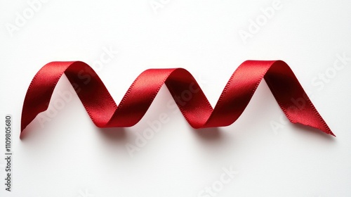 Elegant Red Ribbon Curled on White Background for Celebrations and Decorations