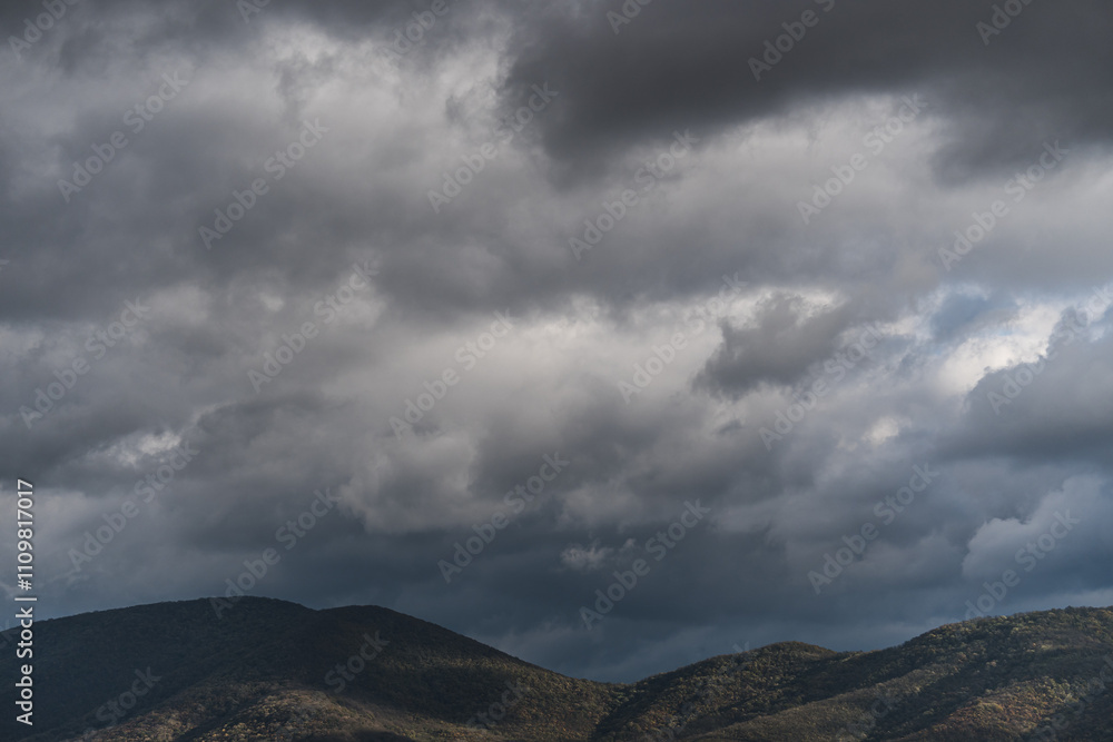 View of hills under rainy clouds View of hills under rainy clouds