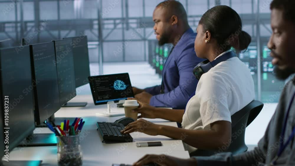 Admin in data center drinking coffee and implementing AI predictive maintenance systems. Server hub worker enjoying hot beverage, using artificial intelligence to identify hardware failures, camera A Admin in data center drinking coffee and implementing AI predictive maintenance systems. Server hub worker enjoying hot beverage, using artificial intelligence to identify hardware failures, camera A