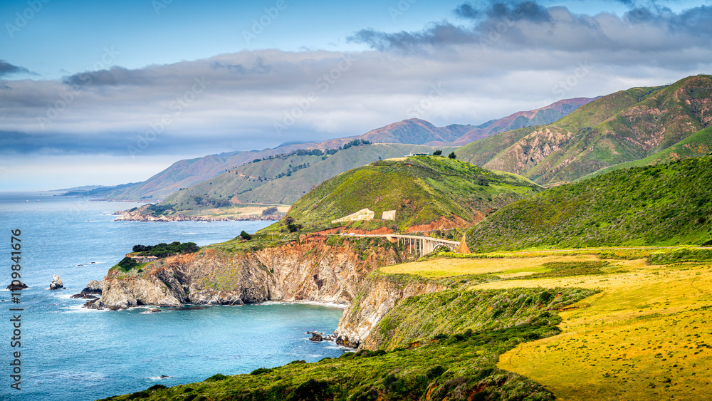The view of Bixby Bridge from Big Sur is breathtaking. Perched high above the rugged California coastline, this iconic arch bridge offers a stunning panorama of the Pacific Ocean The view of Bixby Bridge from Big Sur is breathtaking. Perched high above the rugged California coastline, this iconic arch bridge offers a stunning panorama of the Pacific Ocean