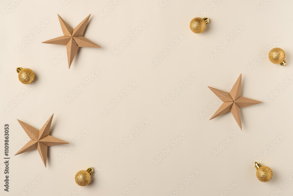 Christmas beige background with gold balls and stars. Flat lay, top view. Copy space Christmas beige background with gold balls and stars. Flat lay, top view. Copy space