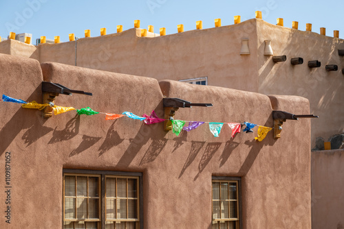 Adobe Brown Mud Architecture Walls Adorned with Colorful Papel Paper Flags in Albuquerque New Mexico