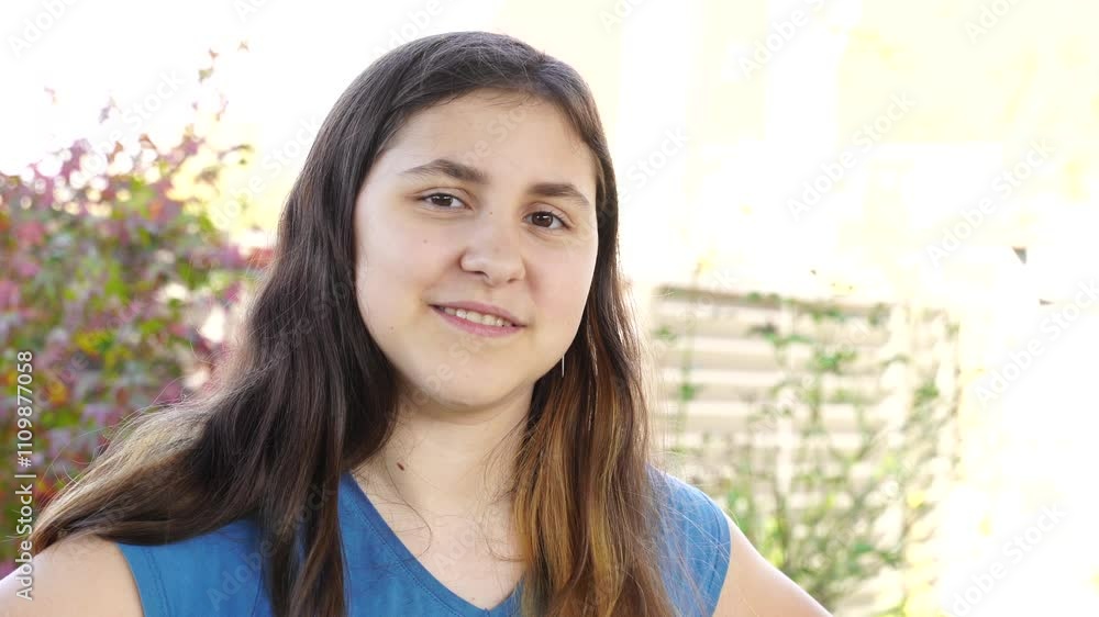 Emotional teenage girl walks outdoors